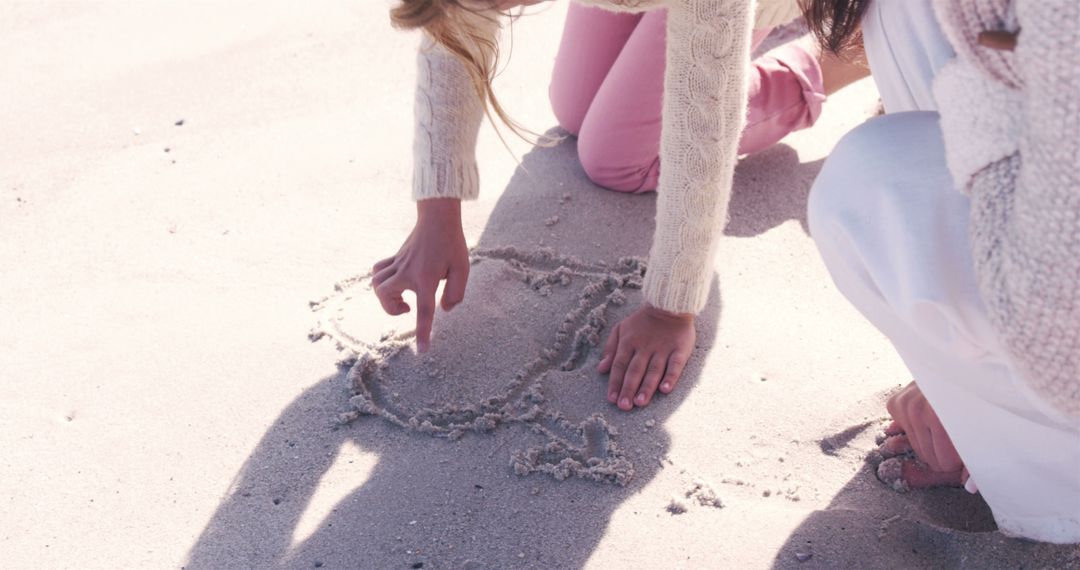 Children Drawing in Sand at Beach - Free Images, Stock Photos and Pictures on Pikwizard.com