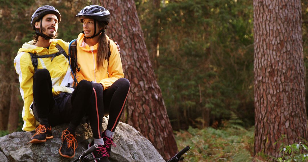 Couple Taking Relaxed Break During Mountain Biking Adventure