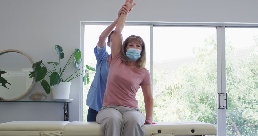 Physical Therapist Working with Senior Woman on Arm Mobility Therapy - Free Images, Stock Photos and Pictures on Pikwizard.com