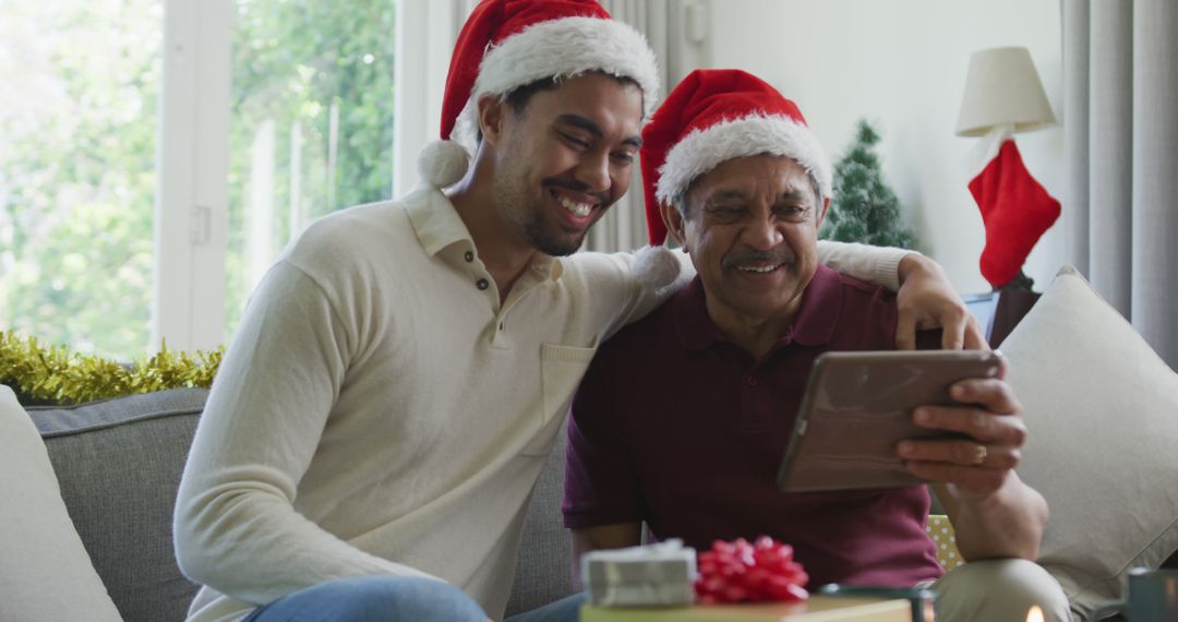 Father and Son Celebrating Virtual Christmas with Video Call - Free Images, Stock Photos and Pictures on Pikwizard.com