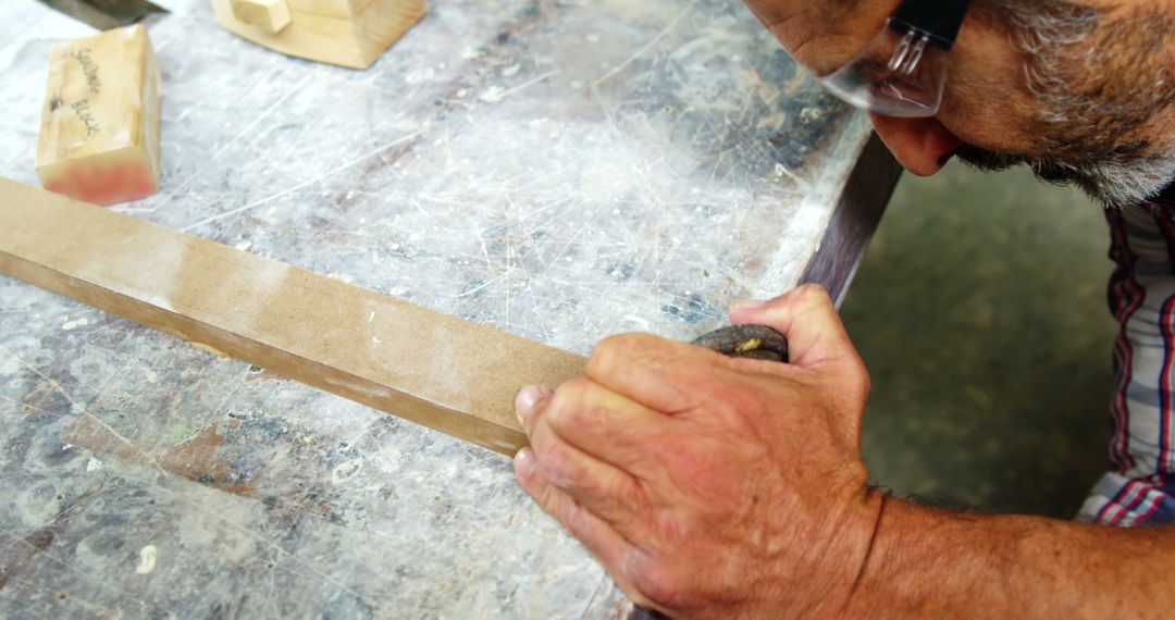 Craftsman Working with Wooden Plank in Workshop - Free Images, Stock Photos and Pictures on Pikwizard.com