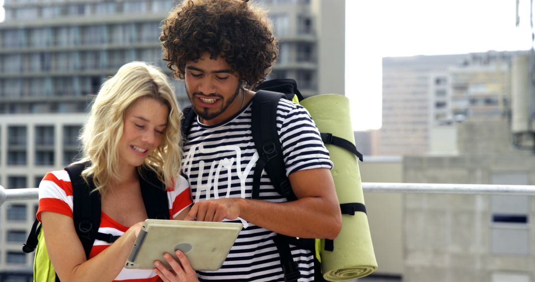 Young Travelers Exploring City Using Tablet