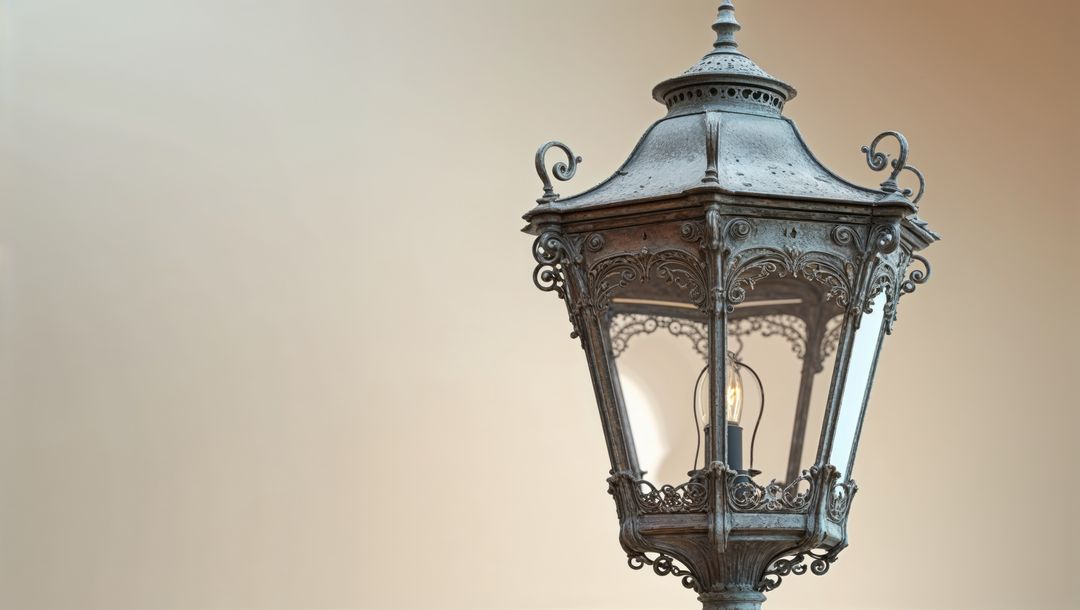 Ornate metal lantern with glowing bulb in trieste, italy