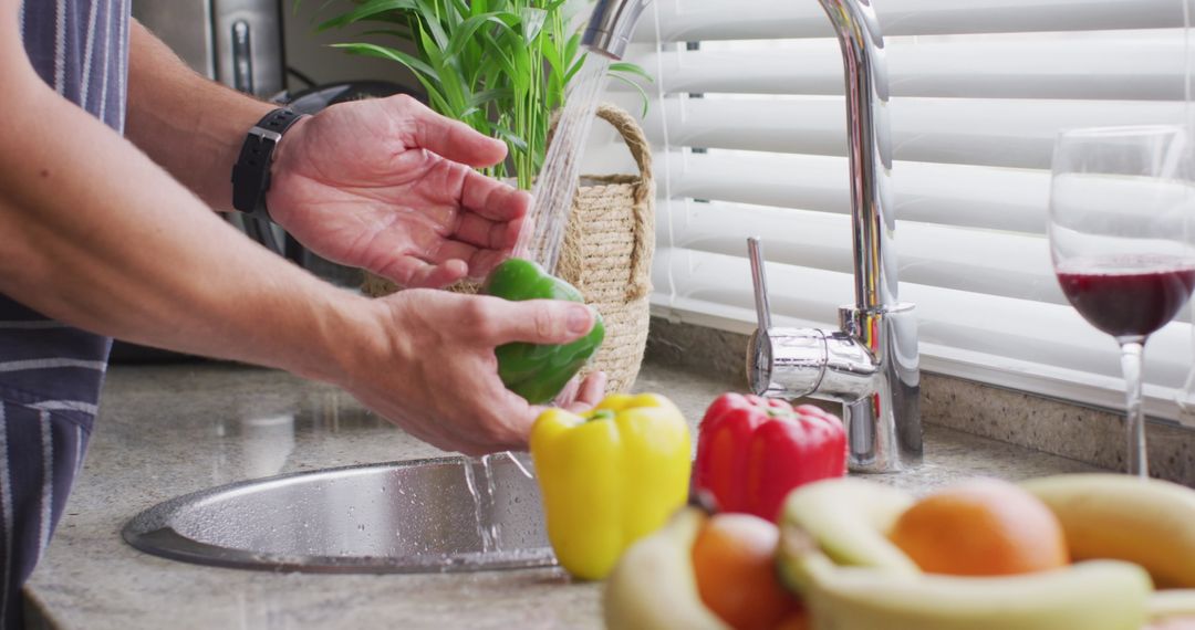 Man Washing Fresh Vegetables in Kitchen Sink with Running Water - Free Images, Stock Photos and Pictures on Pikwizard.com