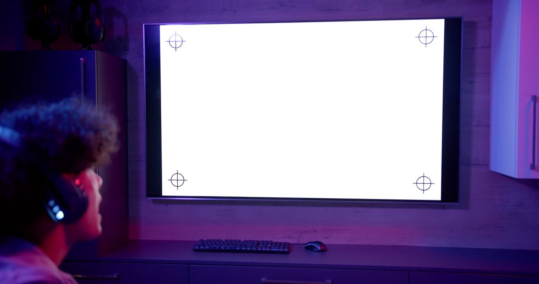 Gamer Immersed in Virtual World with Large Screen Setup