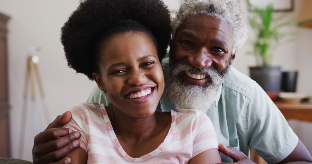 Smiling African American Couple Embracing at Home