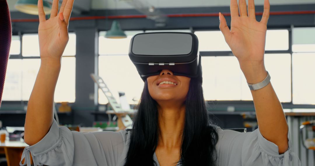 Excited Woman Using Virtual Reality Headset in Office Space - Free Images, Stock Photos and Pictures on Pikwizard.com