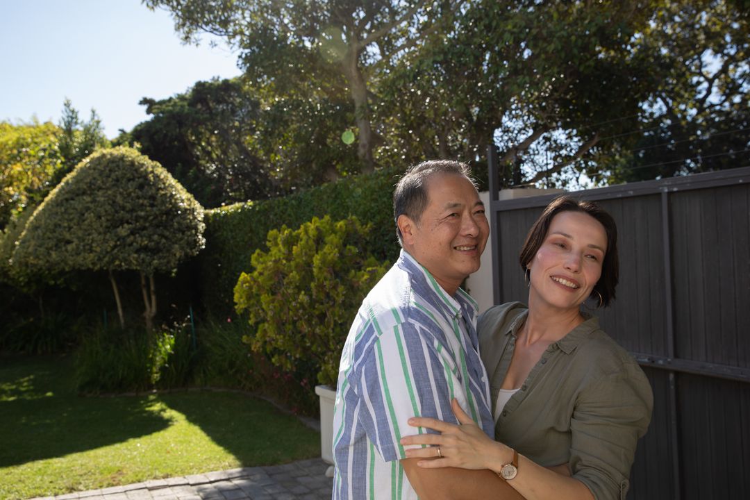 Diverse Couple Embracing in a Sunny Garden