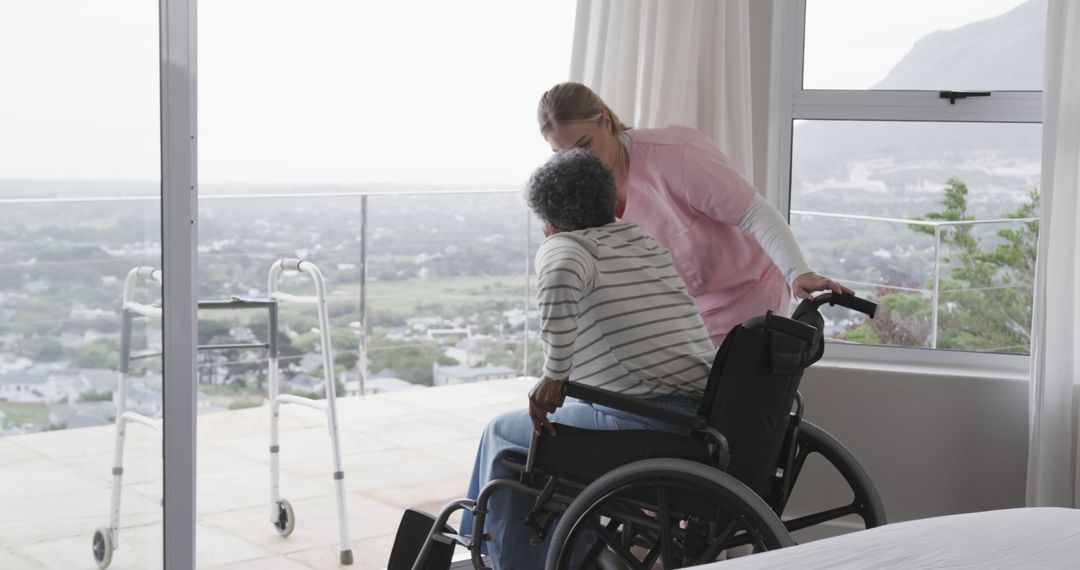 Caregiver Assisting Elderly Patient in Wheelchair by Window - Free Images, Stock Photos and Pictures on Pikwizard.com