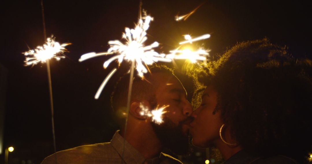 Romantic Couple Kissing with Sparklers Celebrating at Night - Free Images, Stock Photos and Pictures on Pikwizard.com