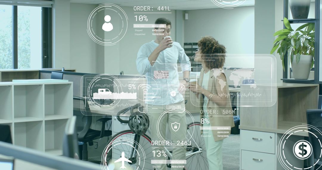 Co-workers Engaged With Digital Interface in Tech-Centric Office Environment