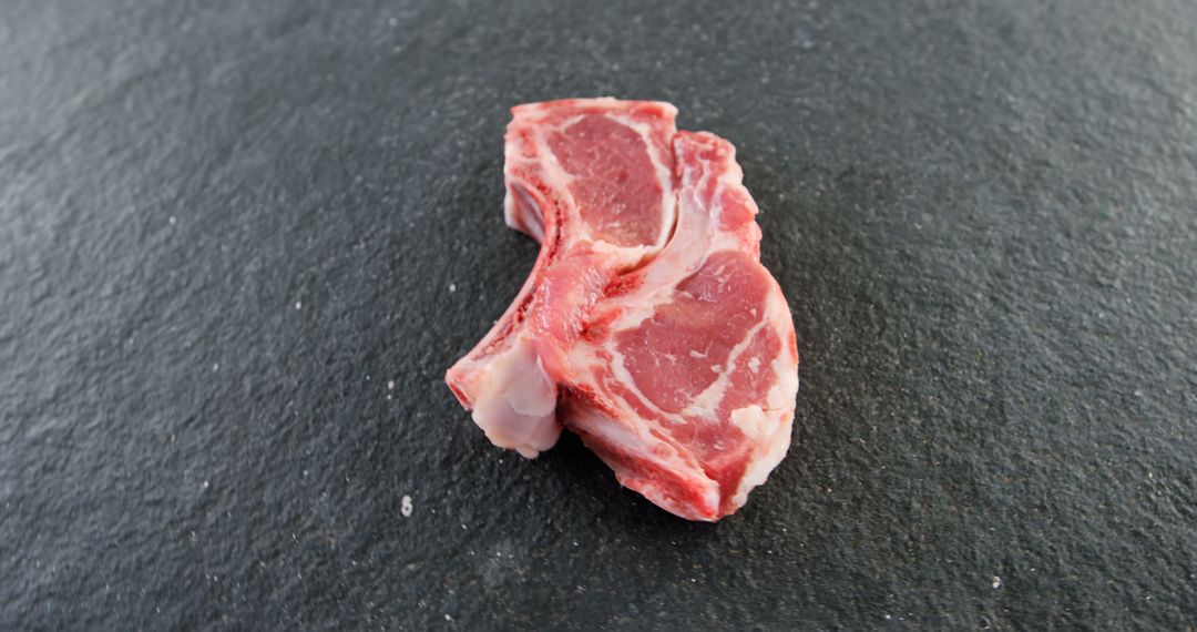 Raw Lamb Chop on Slate Surface Ready for Cooking - Free Images, Stock Photos and Pictures on Pikwizard.com