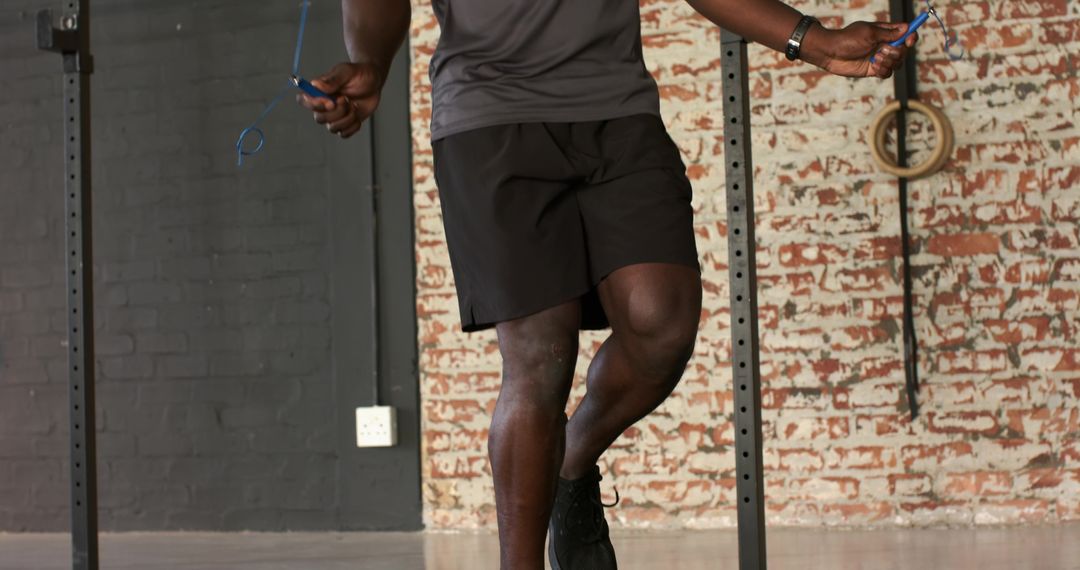 Fit Man Jump Roping in Urban Gym for Cardio Exercise