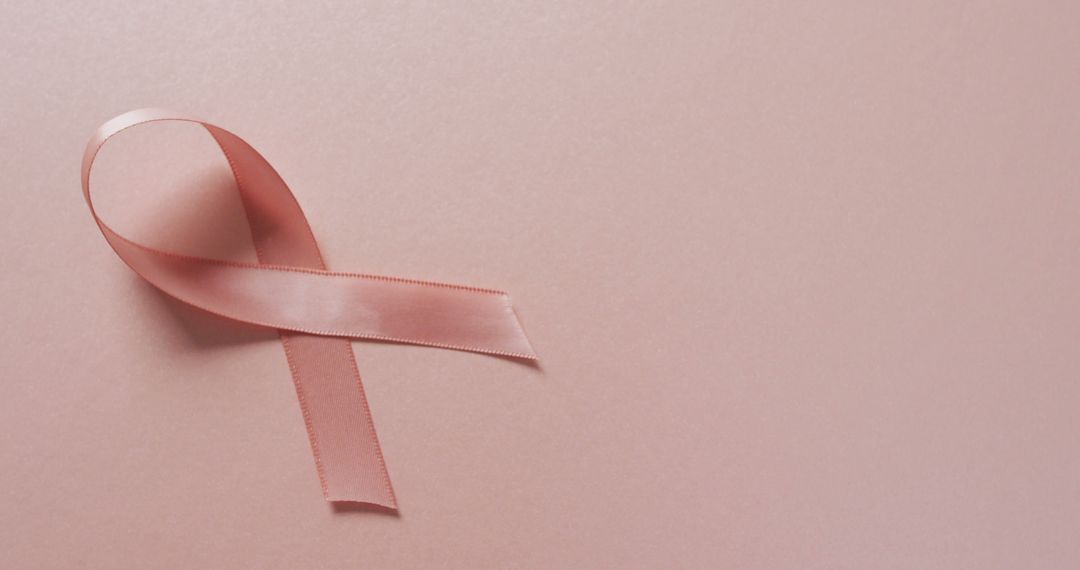 Pink Breast Cancer Ribbon on Pale Pink Background Highlighting Awareness and Support Campaigns - Free Images, Stock Photos and Pictures on Pikwizard.com