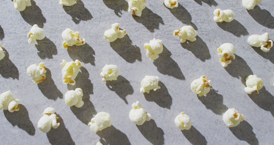 Popcorn Shadows Creating Playful Patterns on Gray Background
