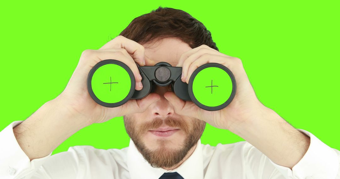 Businessman Looking Through Binoculars With Green Background - Free Images, Stock Photos and Pictures on Pikwizard.com