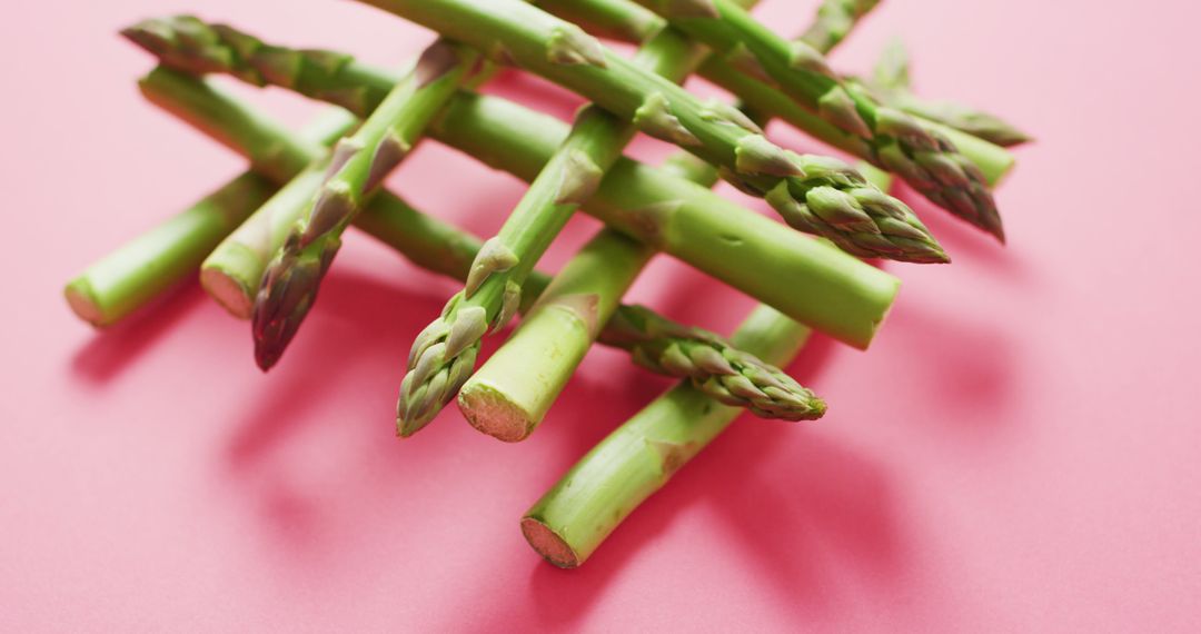 Fresh Asparagus Spears on Pink Background - Free Images, Stock Photos and Pictures on Pikwizard.com