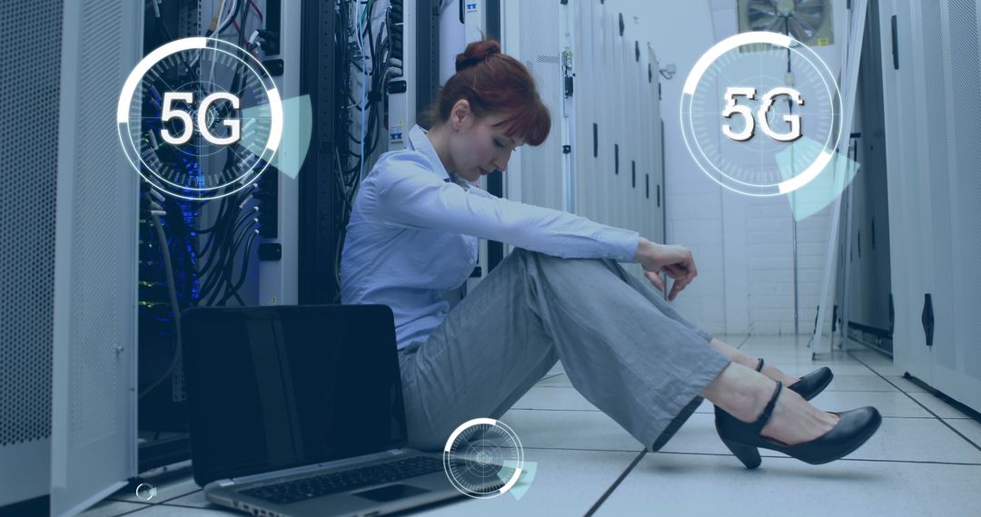 Technician Sitting by Laptop in Server Room with 5G Technology Overlay