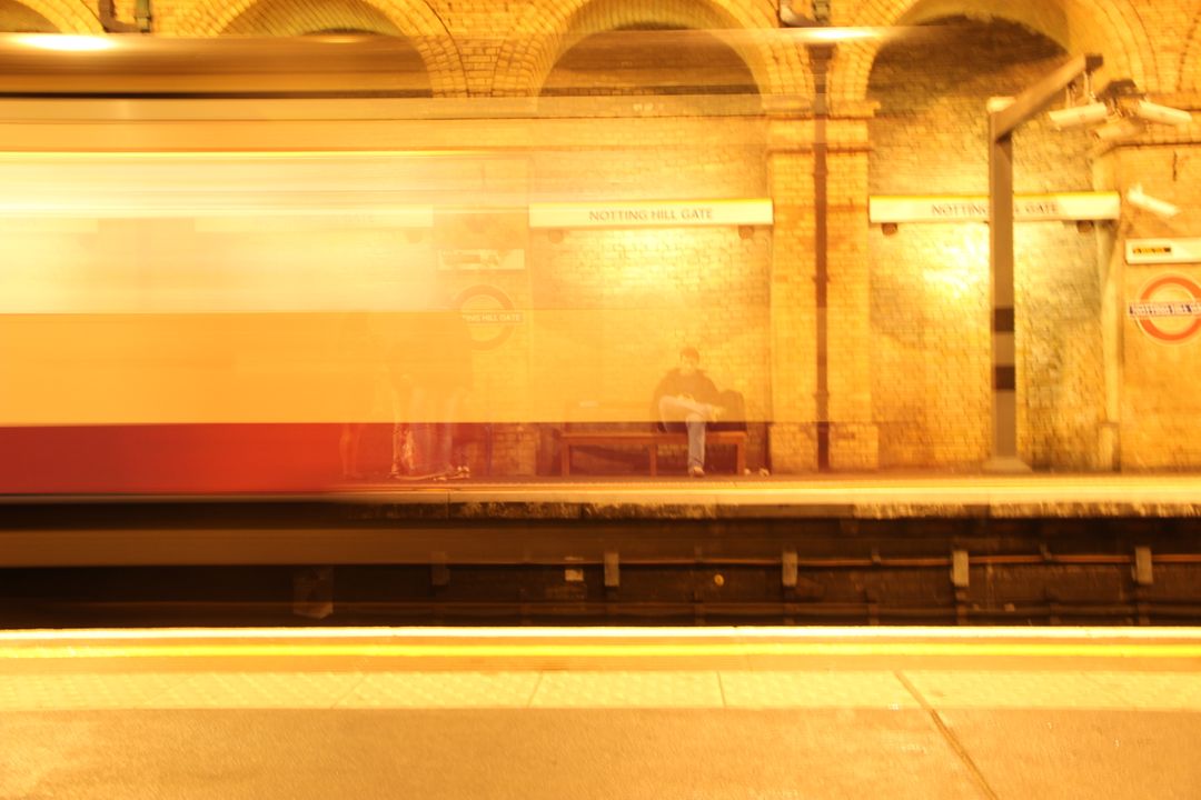 Motion Blur of Train Passing Through Historical Subway Station - Free Images, Stock Photos and Pictures on Pikwizard.com