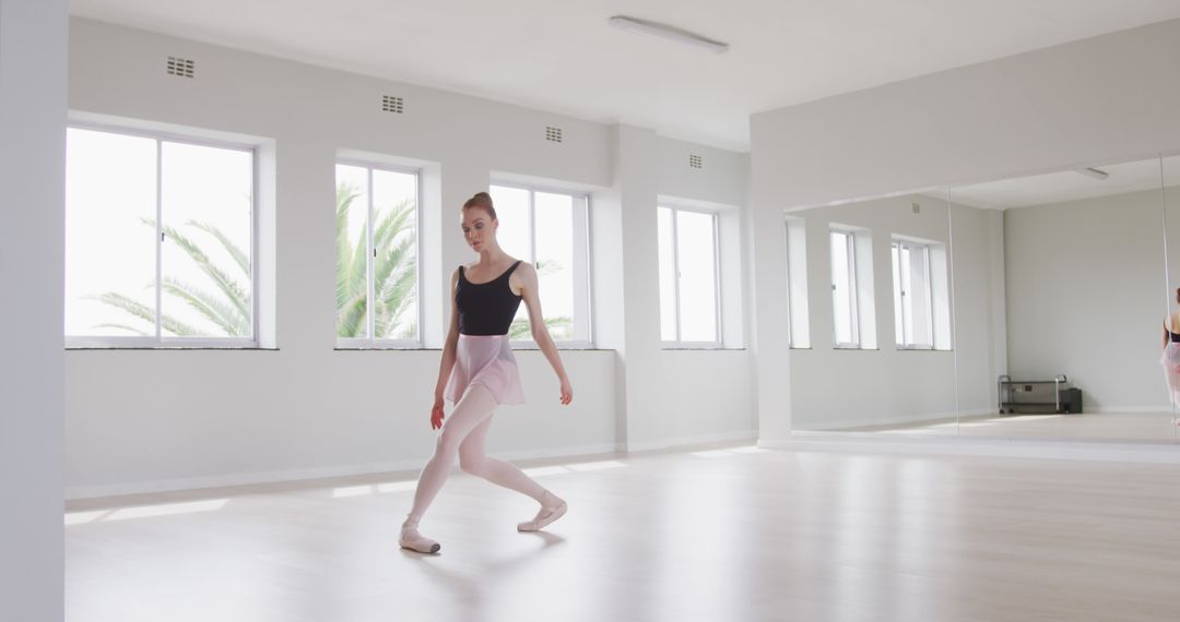 Ballet Dancer Practicing in Bright Studio with Large Windows - Free Images, Stock Photos and Pictures on Pikwizard.com