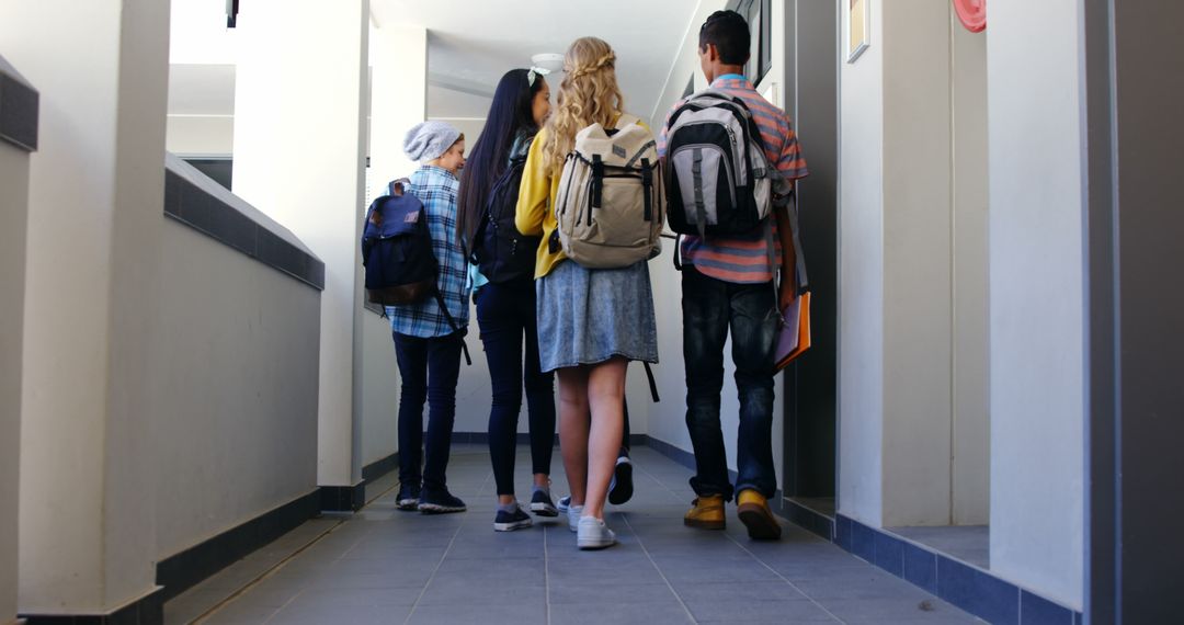 Students Walking in School Hallway Back View - Free Images, Stock Photos and Pictures on Pikwizard.com