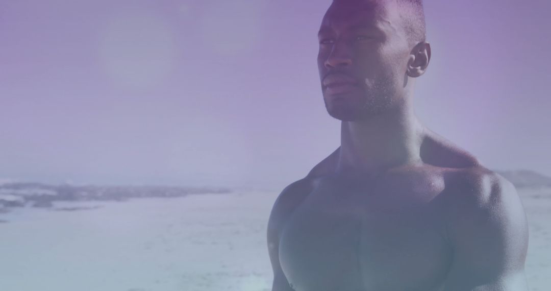Shirtless Man on Tranquil Beach with Pastel Sky