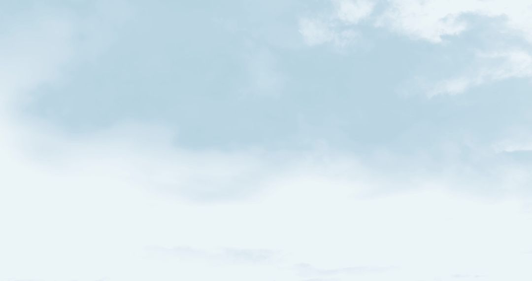 Peaceful Blue Sky with Soft White Clouds