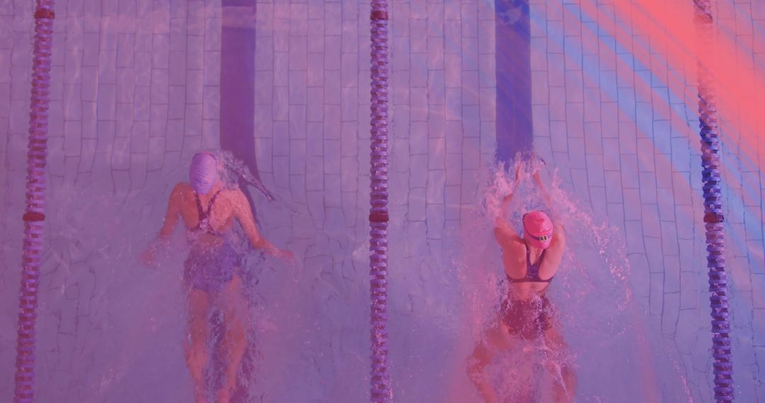 Competitive Swimmers Racing in Pool Event with Vibrant Lighting