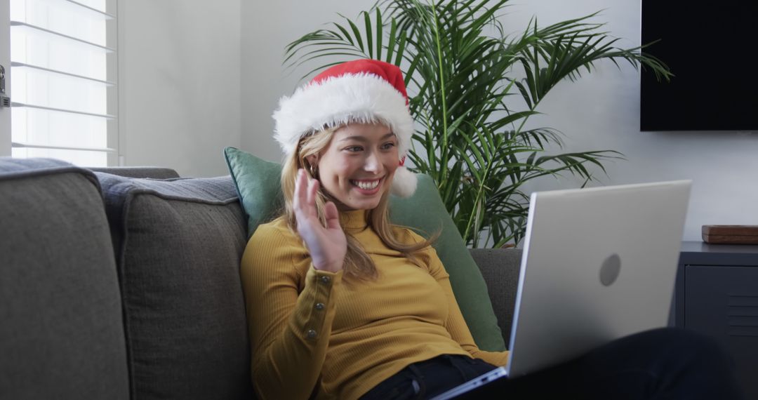 Woman Celebrating Christmas via Video Call at Home - Free Images, Stock Photos and Pictures on Pikwizard.com