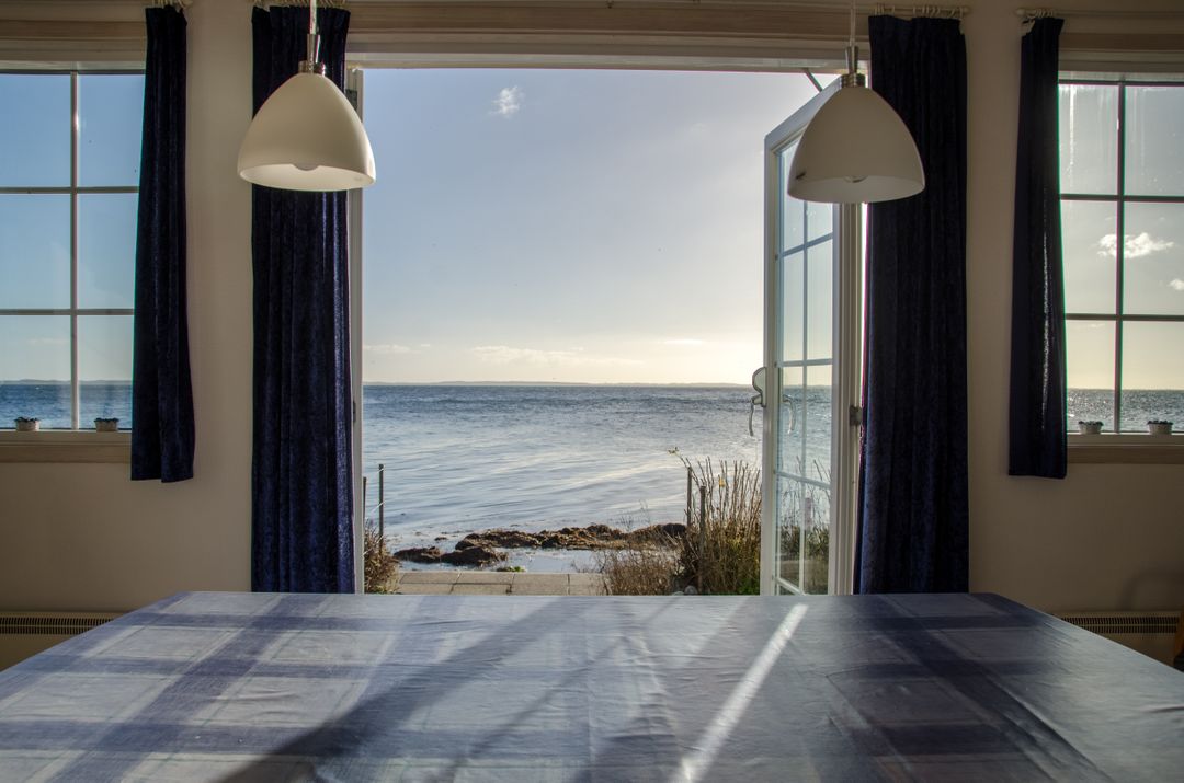 Open Patio Door with Tranquil Ocean View - Free Images, Stock Photos and Pictures on Pikwizard.com