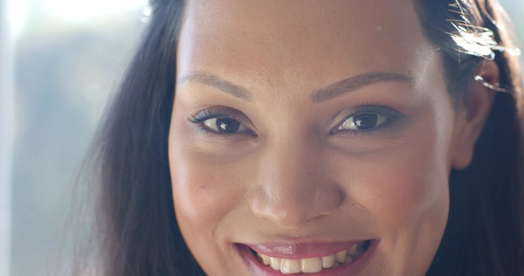Close-up of Happy Woman by Sunny Window with Elegant Hairpin