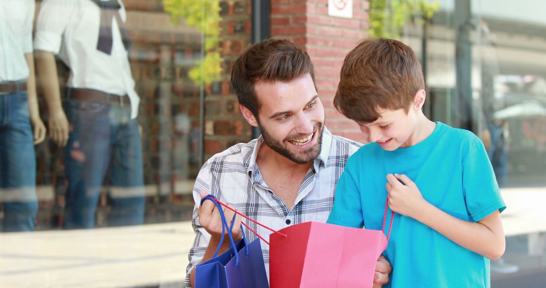 Father and Son Smiling While Shopping Together Outdoors - Free Images, Stock Photos and Pictures on Pikwizard.com