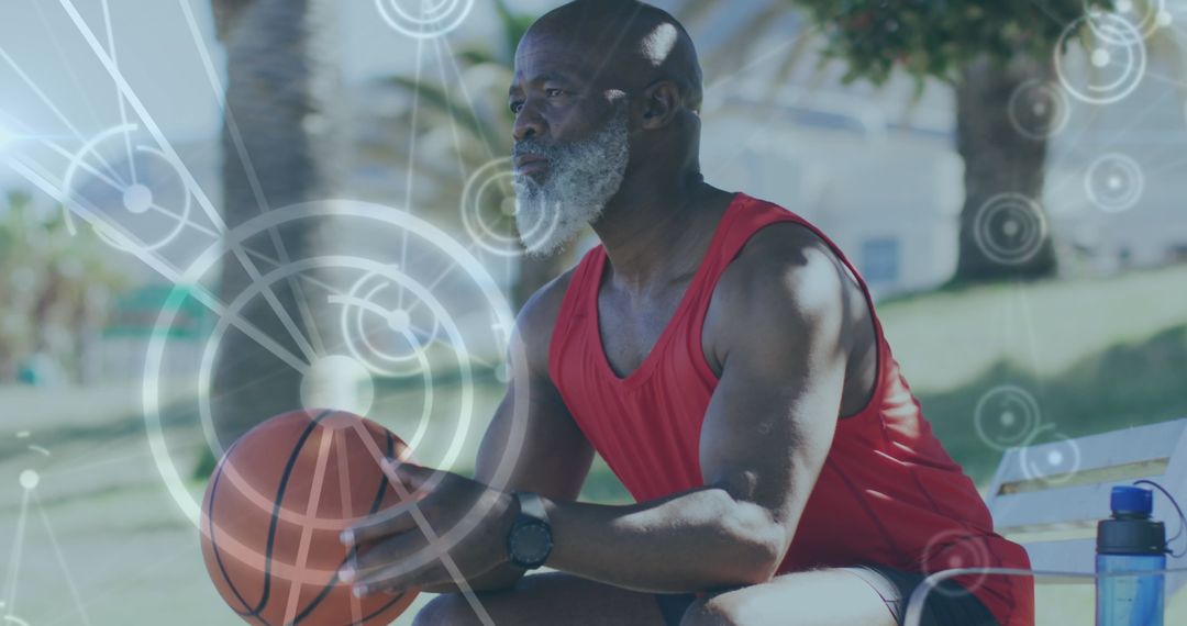 Senior Man with Basketball Connecting to Digital Network