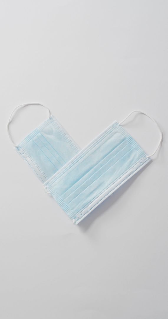 Face Masks Arranged in Heart Shape Symbolizing Healthcare and Love