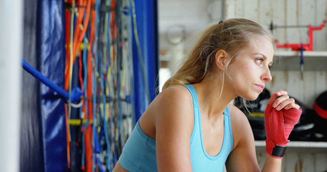 Female Athlete Wearing Boxing Wraps Contemplating During Training - Free Images, Stock Photos and Pictures on Pikwizard.com