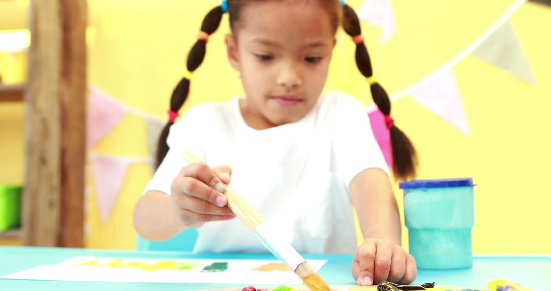 Biracial Preschool Girl Engaged in Coloring Activity at School - Free Images, Stock Photos and Pictures on Pikwizard.com