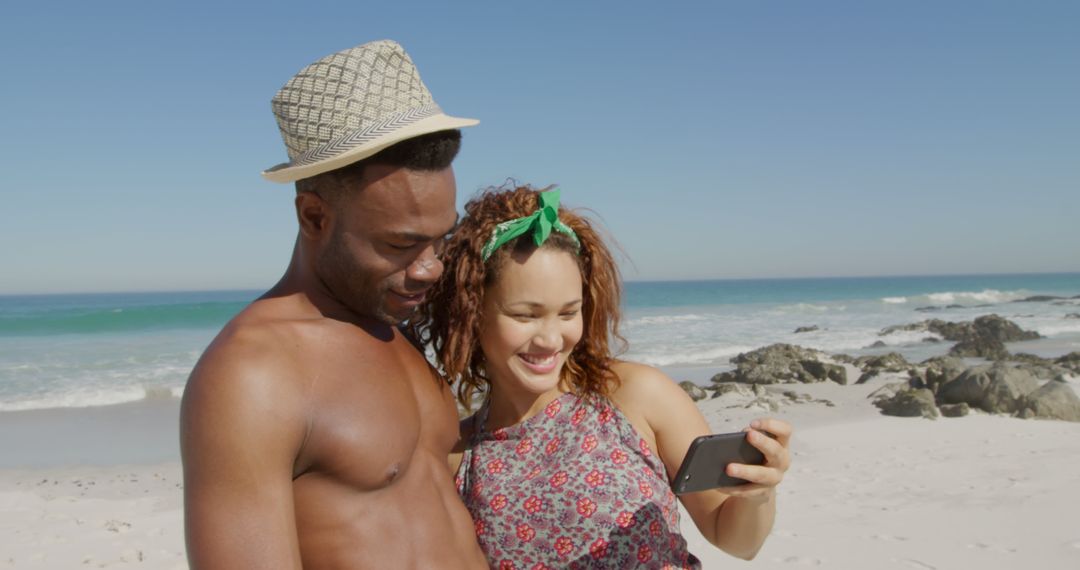 Happy Couple Enjoying Beach Vacation and Taking Selfie - Free Images, Stock Photos and Pictures on Pikwizard.com