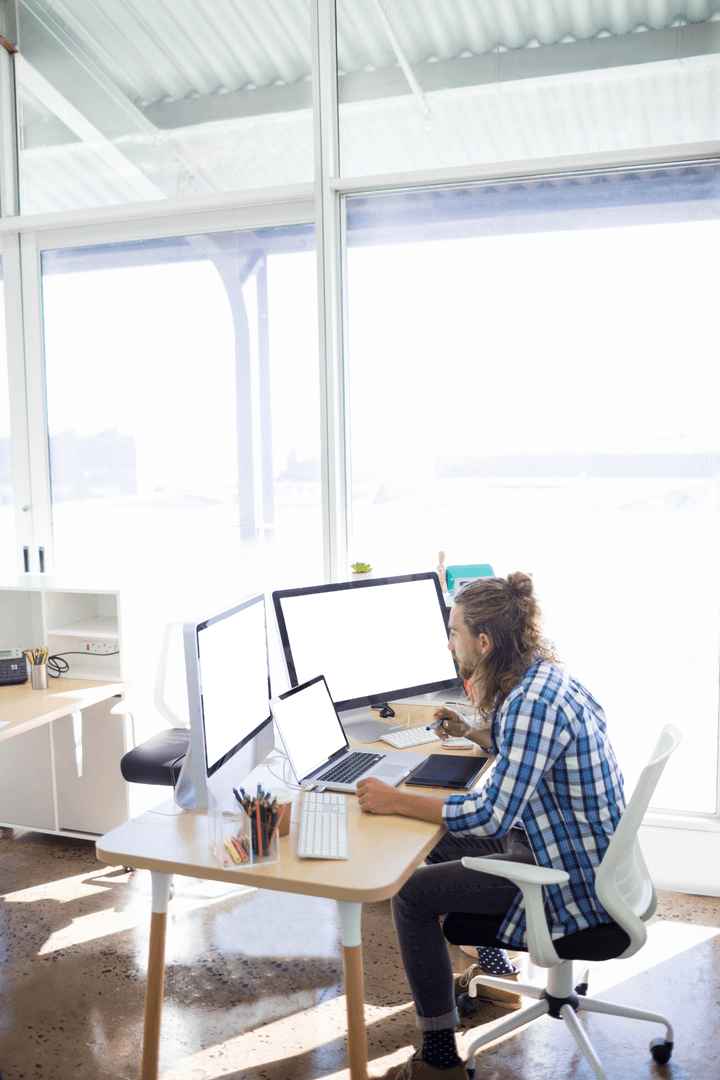 Transparent Office View Featuring Freelancer Working Indoors