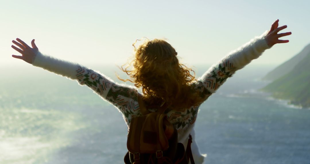 Woman Enjoying Scenic Coastal View with Open Arms - Free Images, Stock Photos and Pictures on Pikwizard.com