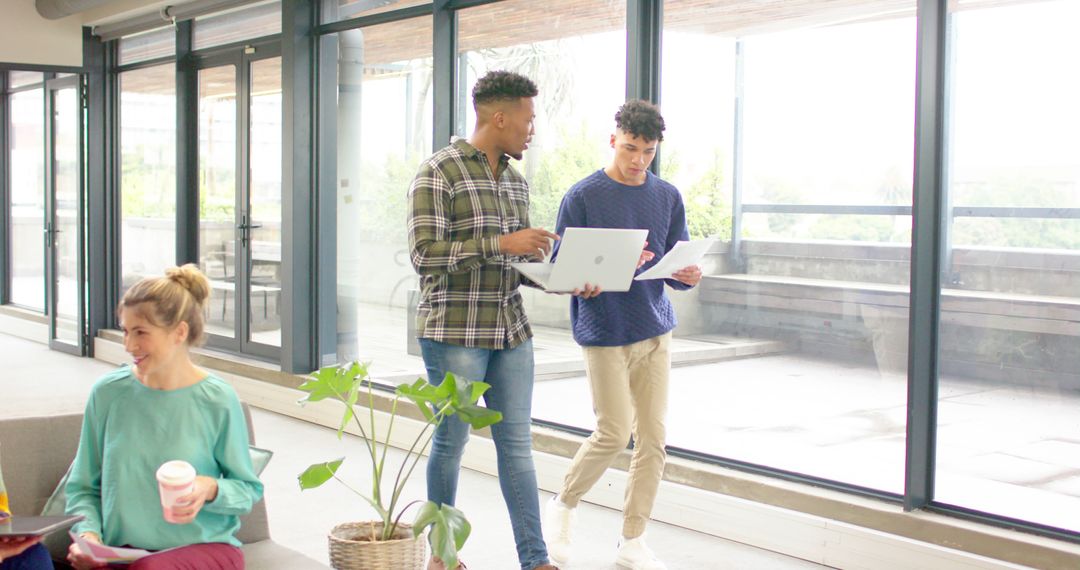 Modern Office Team Collaborating on Project with Technology