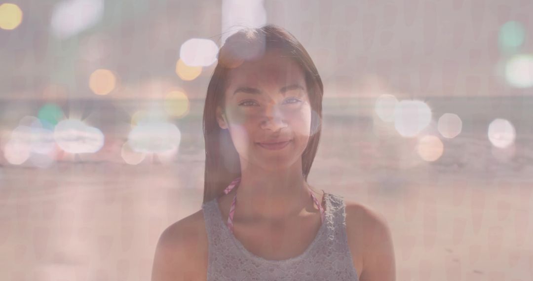 Serene Portrait of Woman on Sandy Beach with Artistic Bokeh Lights