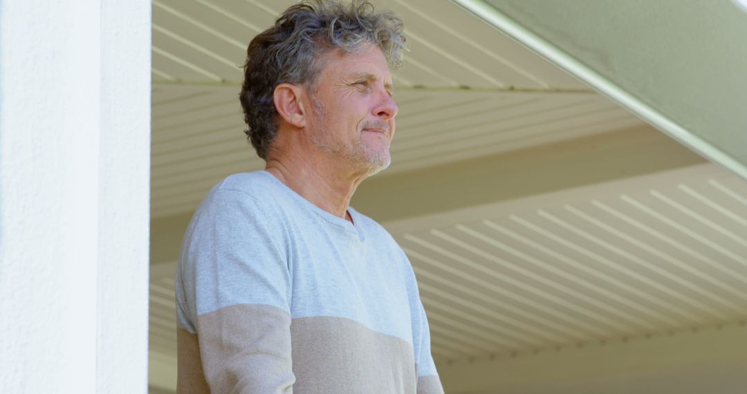 Mature Man Reflecting on Porch during Daytime - Free Images, Stock Photos and Pictures on Pikwizard.com