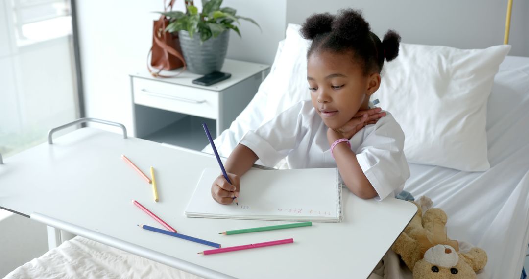 Young African American Girl Drawing with Pencils While Recovering In Hospital Bed - Free Images, Stock Photos and Pictures on Pikwizard.com