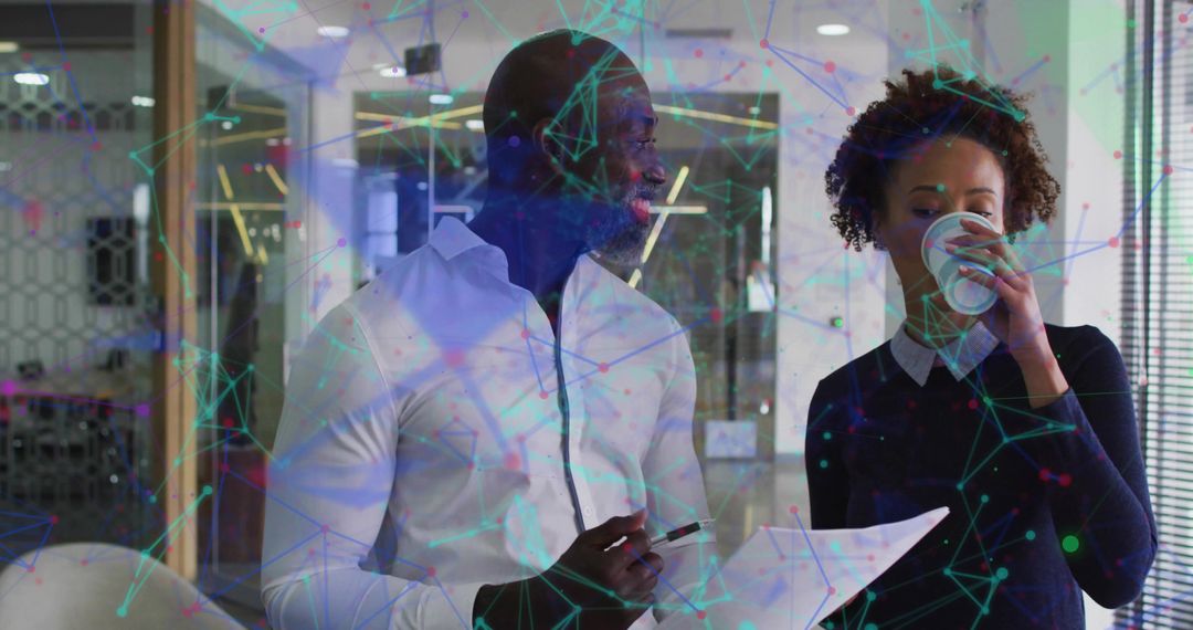 Coworkers Collaborating with Network Graphics in Modern Office