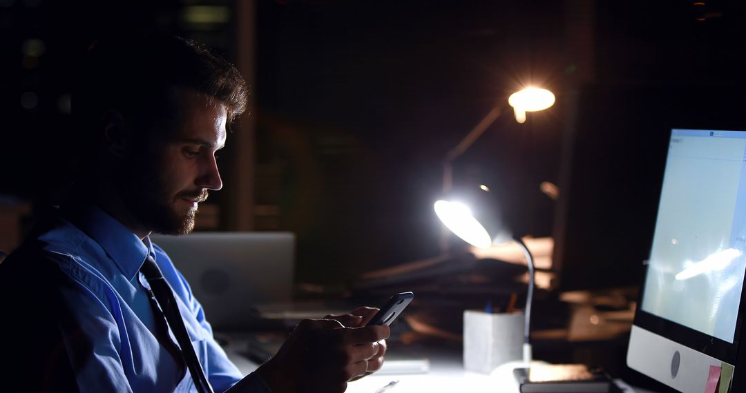 Business Professional Working Late at Night in Office Using Smartphone - Free Images, Stock Photos and Pictures on Pikwizard.com