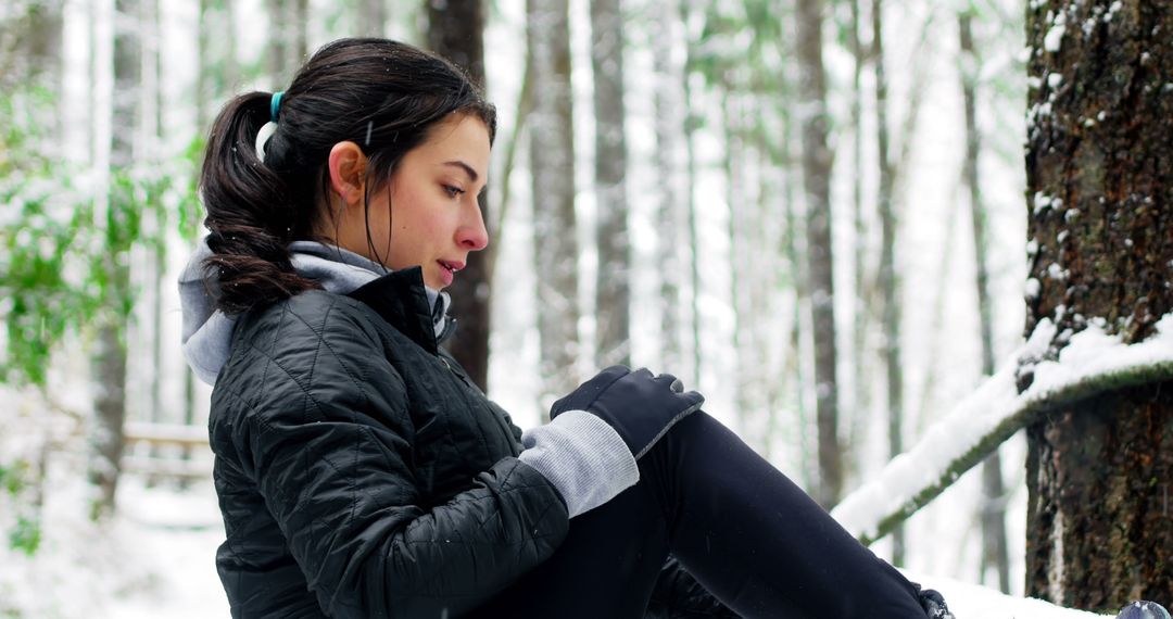 Young Woman Resting in Snowy Forest, Winter Outdoor Activity - Free Images, Stock Photos and Pictures on Pikwizard.com