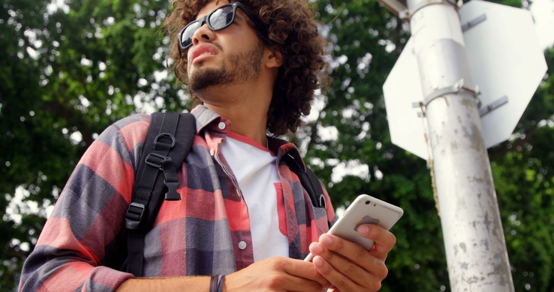 Young Man Navigating City Streets Using Smartphone - Free Images, Stock Photos and Pictures on Pikwizard.com