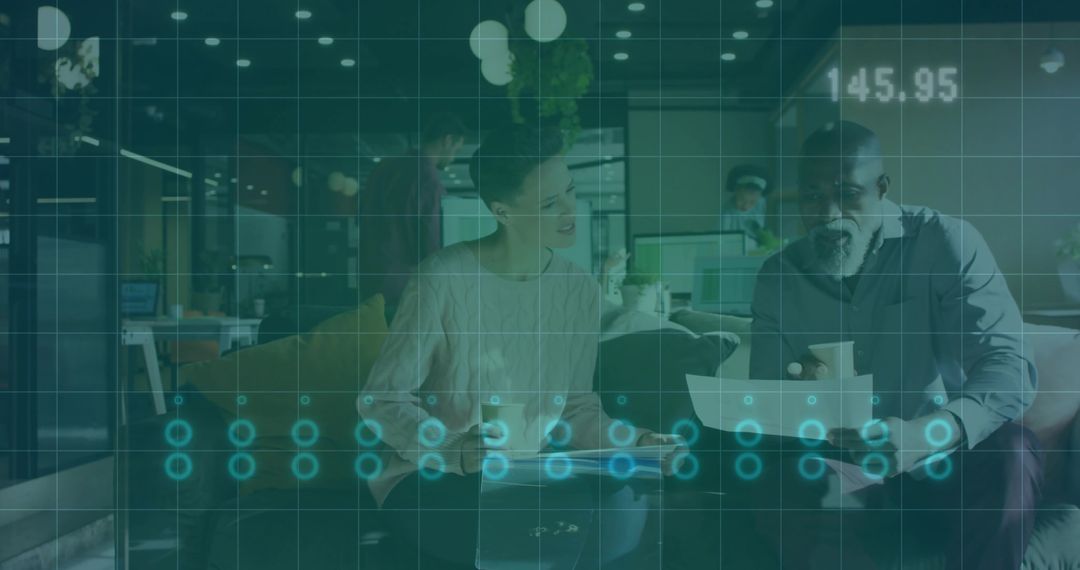 Coworking collaboration reviewing documents over coffee in lounge with digital data overlay