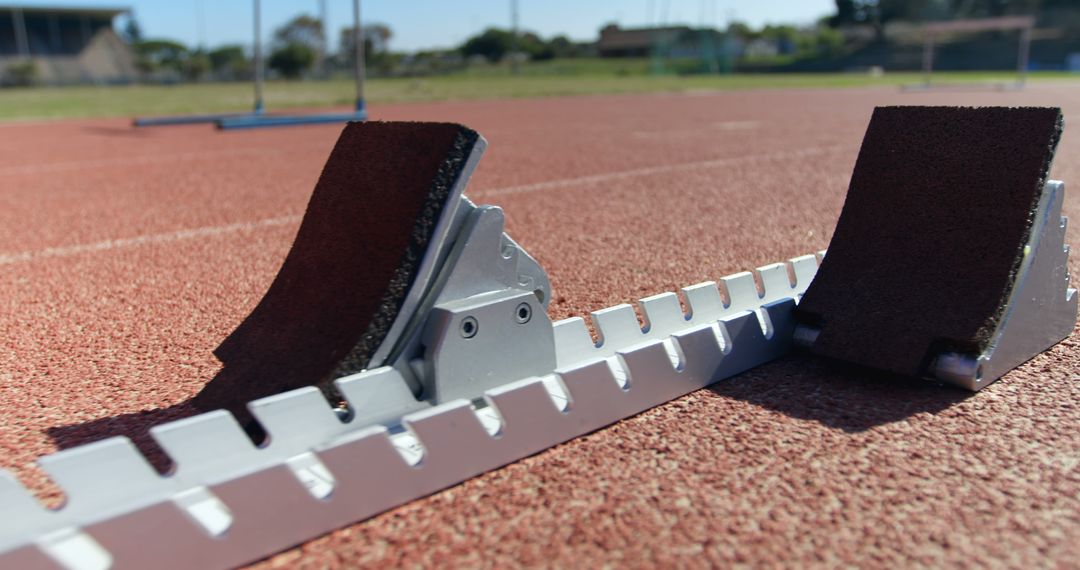 Starting Blocks on Outdoor Athletics Track Under Sunny Sky - Free Images, Stock Photos and Pictures on Pikwizard.com