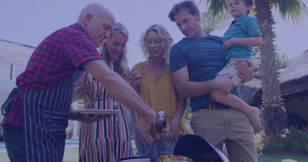 Multi-generational Family Enjoying Outdoor Barbecue Gathering